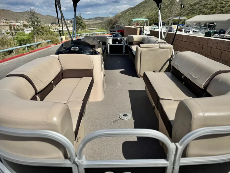 Slide: The Image of 2018 Sun Tracker Party Barge 22 DLX with spacious seating and scenic mountain backdrop. - 8