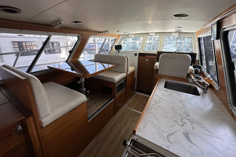 Slide: The Image of Interior of 2020 Coastal Craft 33 ProFish boat with modern seating and countertops. - 27