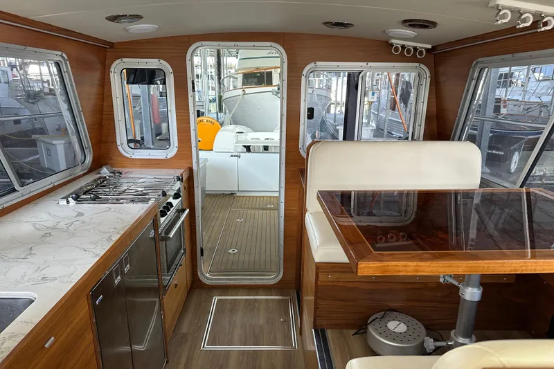 Slide: The Image of Interior of 2020 Coastal Craft 33 ProFish boat with wood finish and modern amenities. - 31