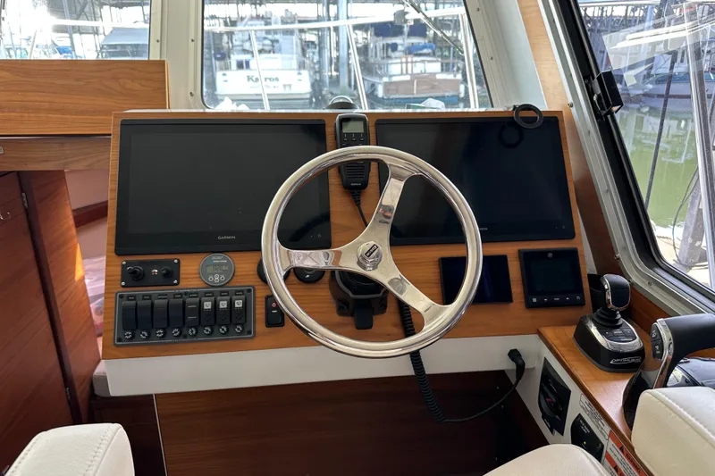 Slide: The Image of 2020 Coastal Craft 33 ProFish helm with dual screens and modern controls. - 36