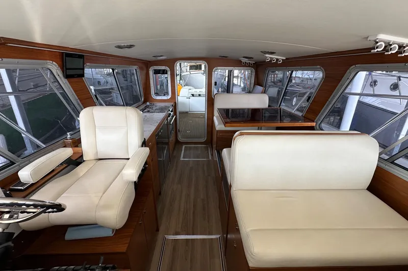 Slide: The Image of Interior of 2020 Coastal Craft 33 ProFish with luxurious seating and wood accents. - 40