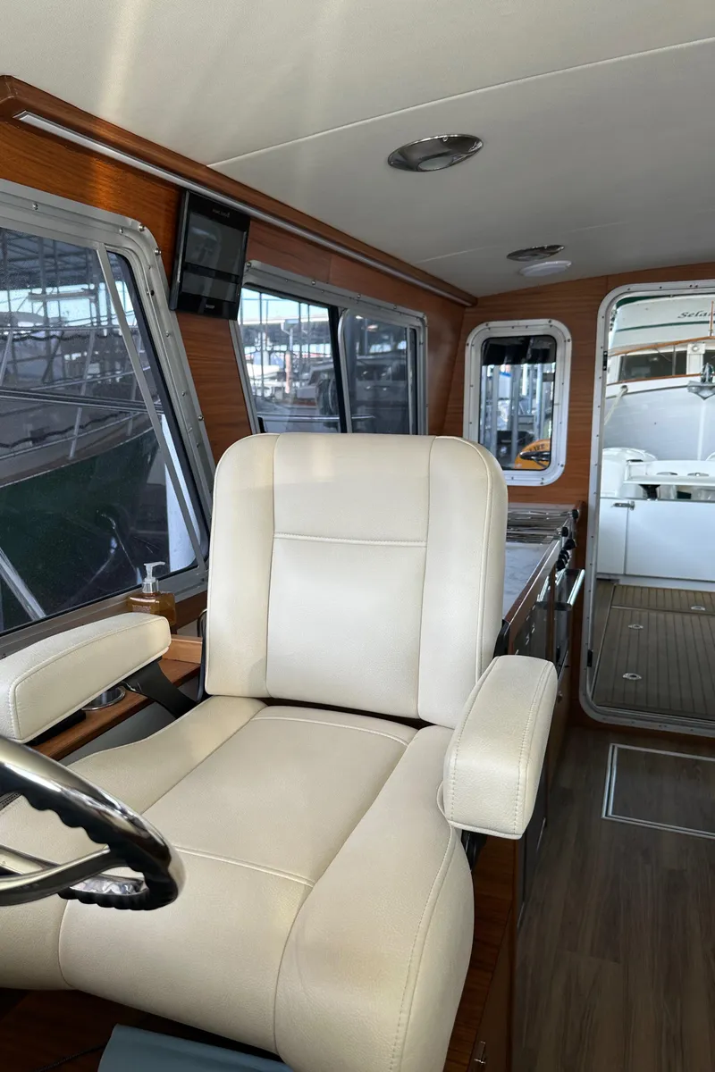 Slide: The Image of Interior of 2020 Coastal Craft 33 ProFish boat with plush seating and modern design. - 41