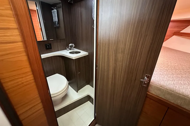 Slide: The Image of 2020 Coastal Craft 33 ProFish bathroom interior with modern wood finish and compact design. - 45