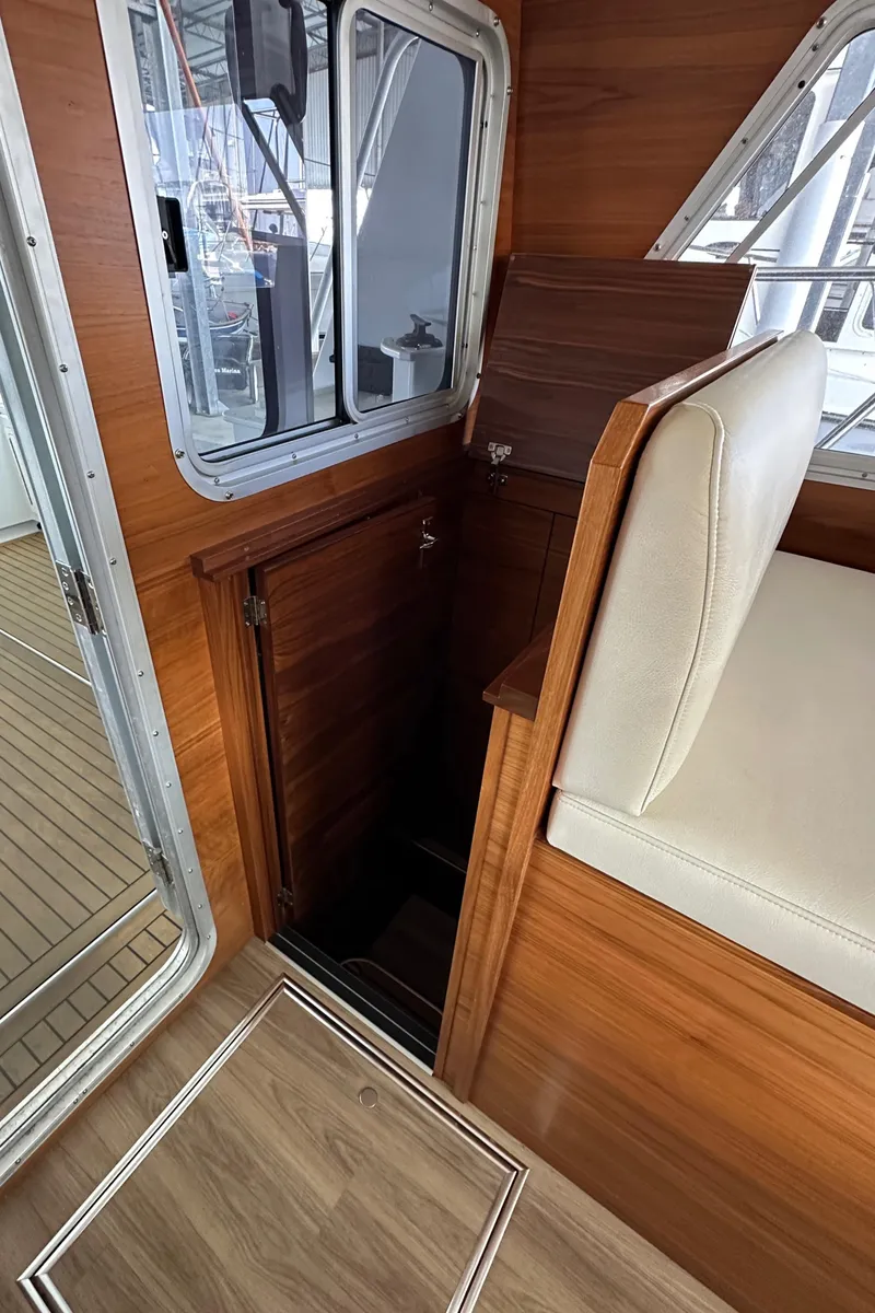 Slide: The Image of 2020 Coastal Craft 33 ProFish interior with wood finish and seating. - 48