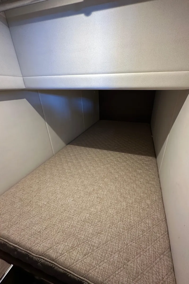 Slide: The Image of Interior cabin of 2020 Coastal Craft 33 ProFish, featuring a cozy sleeping area. - 50