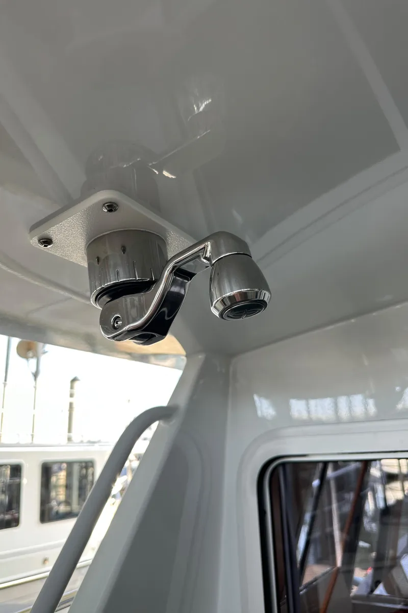 Slide: The Image of Ceiling-mounted light fixture inside a 2020 Coastal Craft 33 ProFish boat. - 54