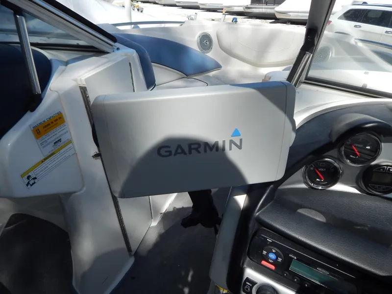 Slide: The Image of 2013 Bayliner 235 Bowrider dashboard with Garmin navigation system. - 14