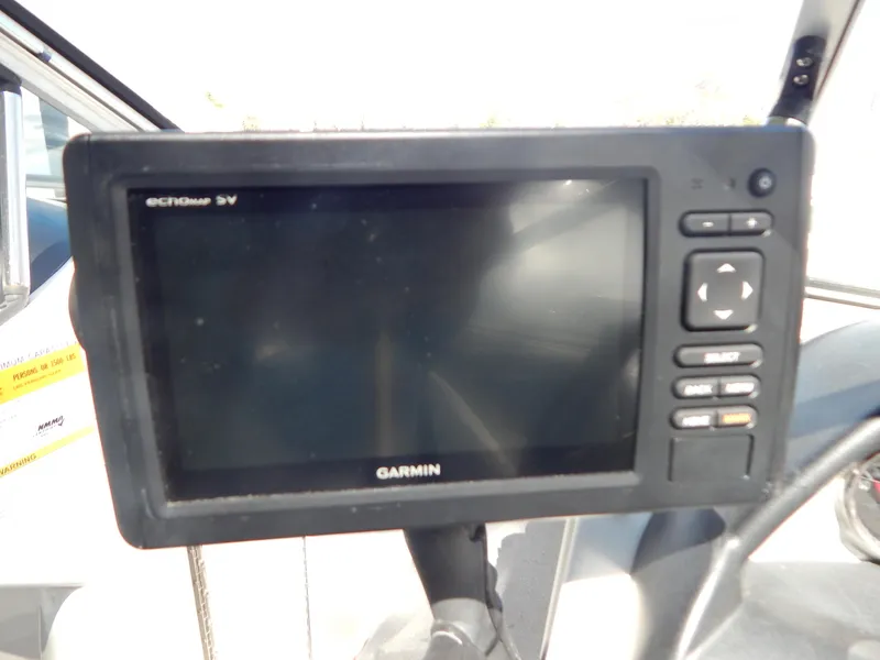 Slide: The Image of Garmin GPS device on 2013 Bayliner 235 Bowrider boat dashboard. - 15