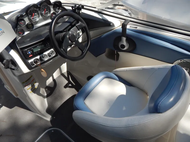 Slide: The Image of 2013 Bayliner 235 Bowrider cockpit with steering wheel and instrument panel. - 17