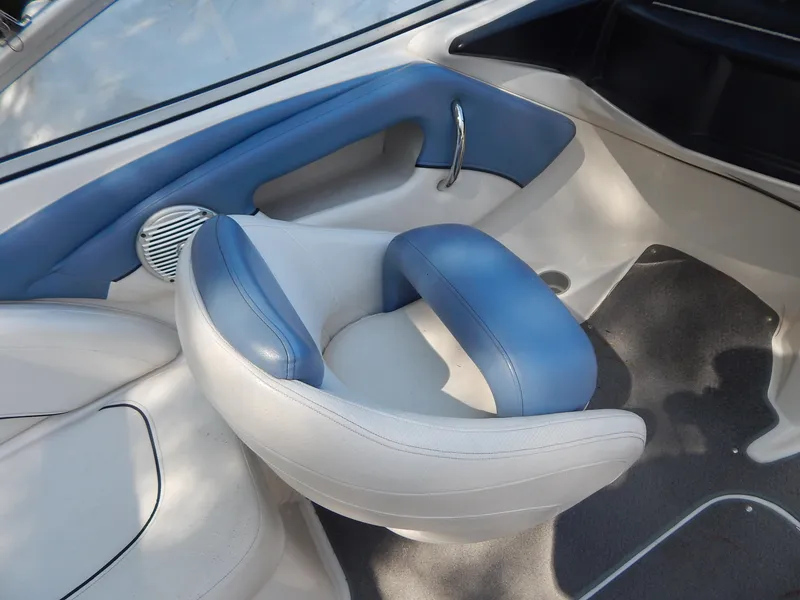 Slide: The Image of 2013 Bayliner 235 Bowrider interior with blue and white seating. - 20