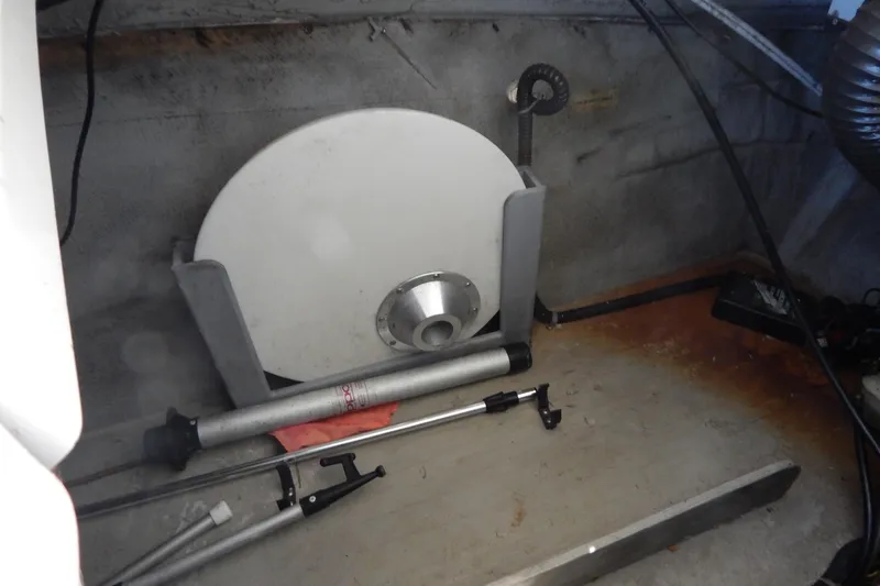 Slide: The Image of Storage compartment of a 2013 Bayliner 235 Bowrider with boating equipment. - 34