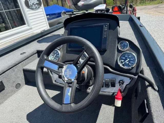 Slide: The Image of 2023 Ranger RT178 boat dashboard with steering wheel and gauges. - 5