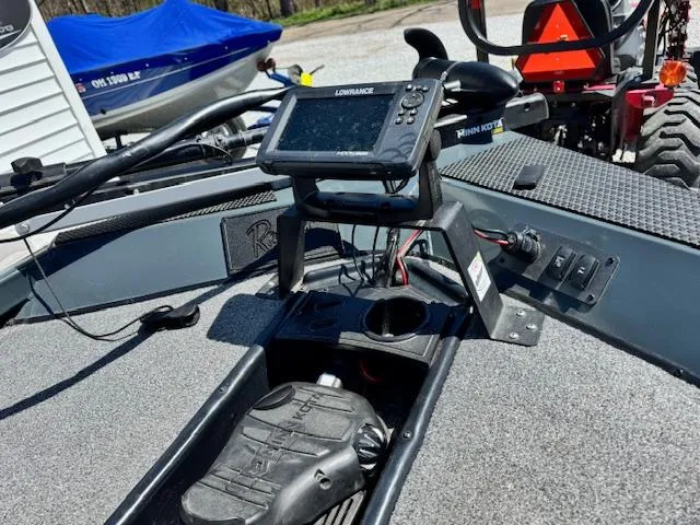 Slide: The Image of 2023 Ranger RT178 boat dashboard with Lowrance fishfinder and control pedals. - 7