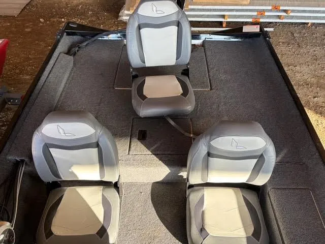 Slide: The Image of 2025 Lowe Skorpion 17 boat interior with three gray and white seats. - 11