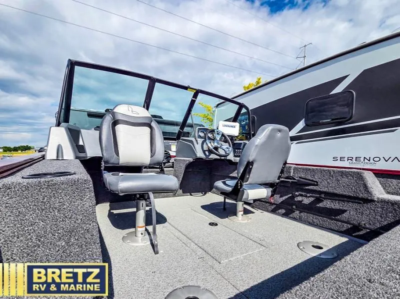 Slide: The Image of Interior view of Machine Walk Thru FM 1625 WT boat, featuring seating and controls. - 18