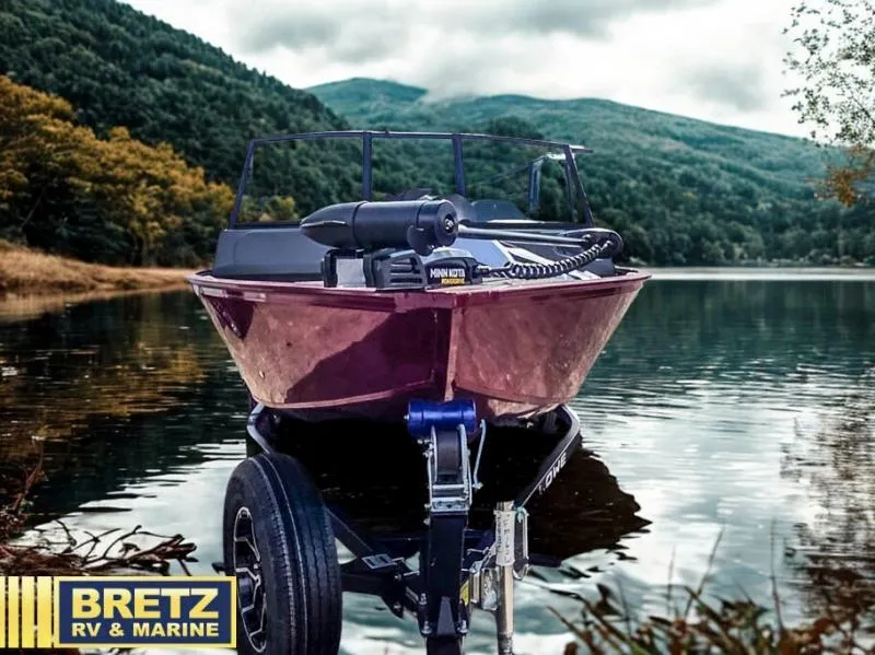 Slide: The Image of 2025 Machine Walk Thru FM 1625 WT boat on trailer by scenic lake. - 3