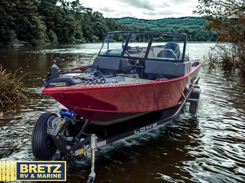 Slide: The Image of Red boat on trailer by lake, featuring Minn Kota motor, Bretz RV & Marine branding. - 4
