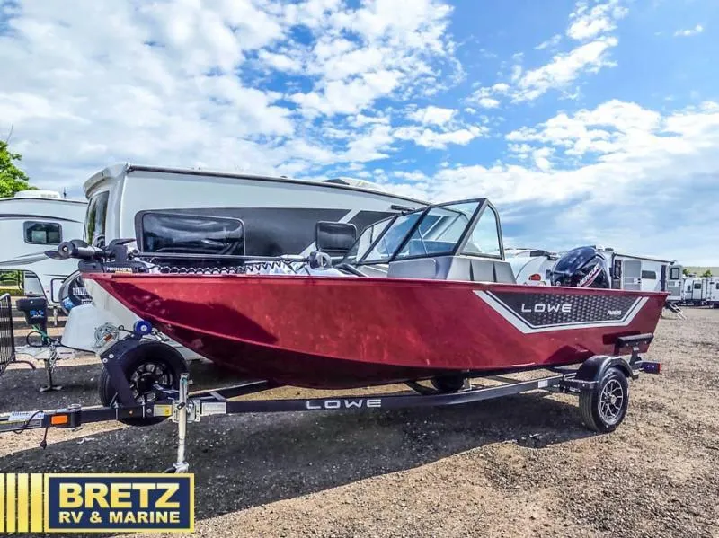 Slide: The Image of Red Lowe boat on trailer at Bretz RV & Marine dealership, parked near RVs under a blue sky. - 5