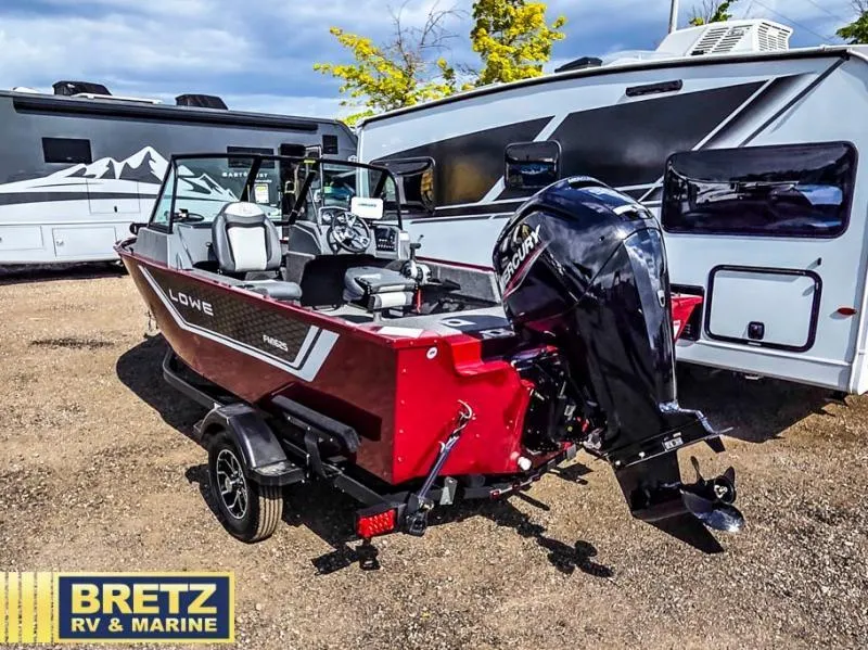 Slide: The Image of Red Lowe fishing boat with Mercury engine parked near RVs at Bretz RV & Marine. - 6
