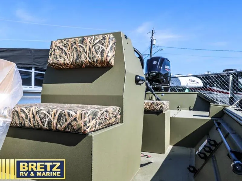 Slide: The Image of 2025 Roughneck RX1860 Tunnel Jet boat with camo seats at Bretz RV & Marine. - 14