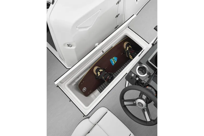 Slide: The Image of 2025 Yamaha AR250 boat interior with wakeboard storage compartment. - 5