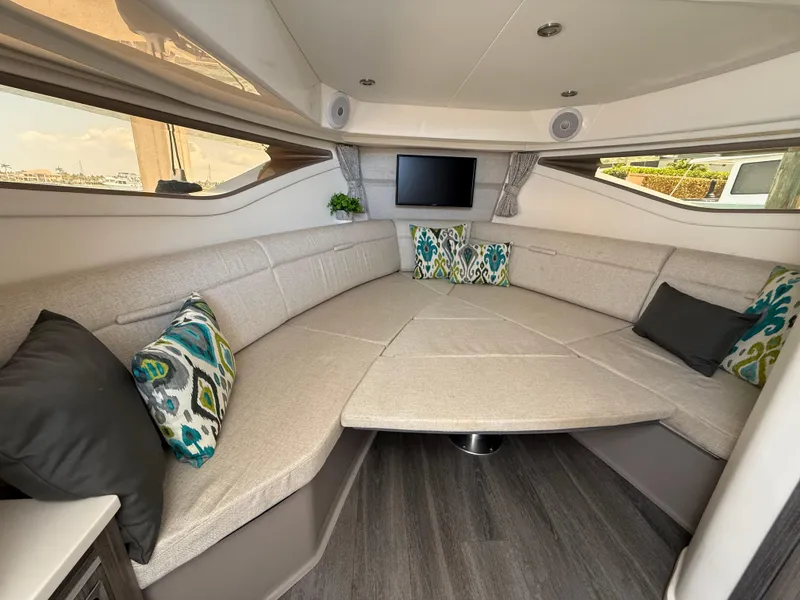 Slide: The Image of Luxurious interior of 2022 Sea Ray Sundancer 320 OB with plush seating and modern decor. - 6