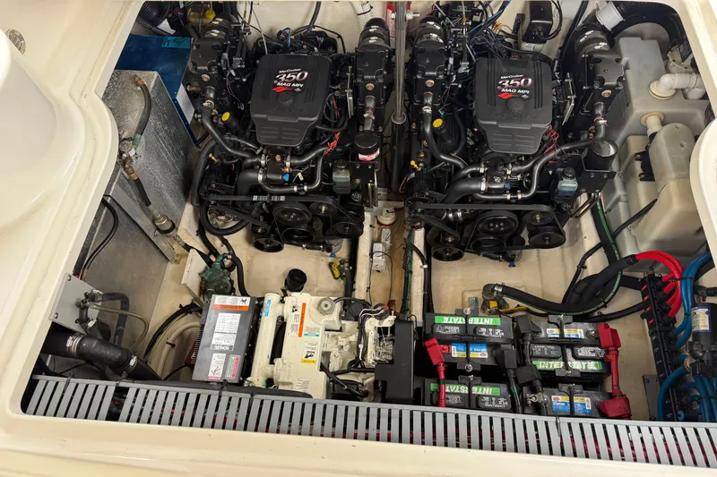 Slide: The Image of Engine compartment of a 2004 Sea Ray 300 Sundancer with twin 250 horsepower motors. - 30