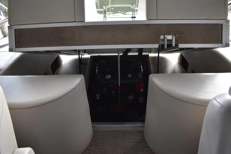 Slide: The Image of 2013 Bennington 2575 QCW I/O boat interior with open engine compartment. - 11