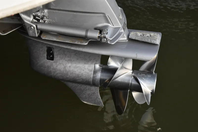 Slide: The Image of Close-up of a 2013 Bennington 2575 QCW I/O boat propeller in water. - 12