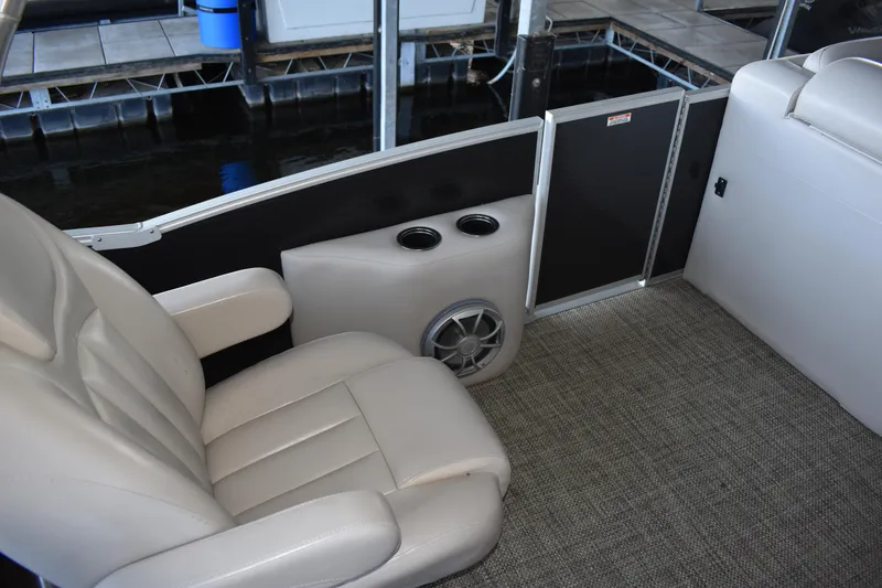 Slide: The Image of Luxurious seating on 2013 Bennington 2575 QCW I/O boat with cup holders and speaker. - 31