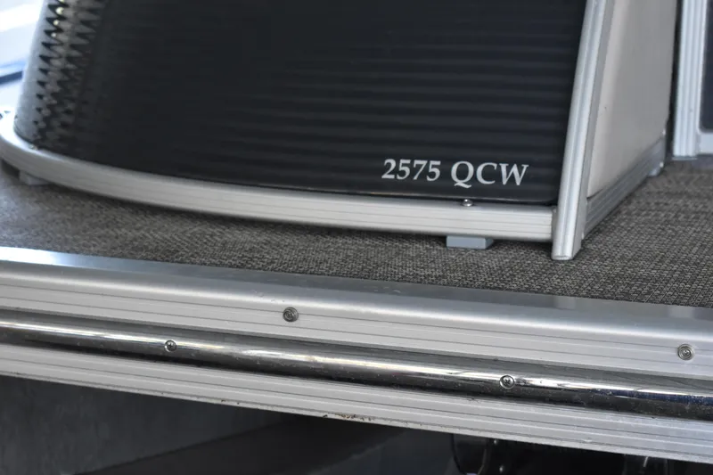 Slide: The Image of 2013 Bennington 2575 QCW I/O boat detail, showcasing model name on deck. - 38