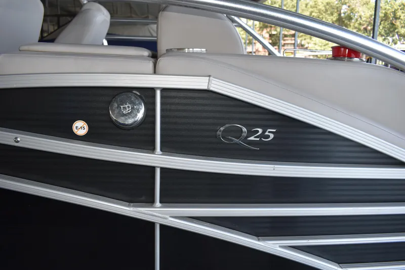 Slide: The Image of 2013 Bennington 2575 QCW I/O boat, side view with Q25 logo and sleek design. - 42
