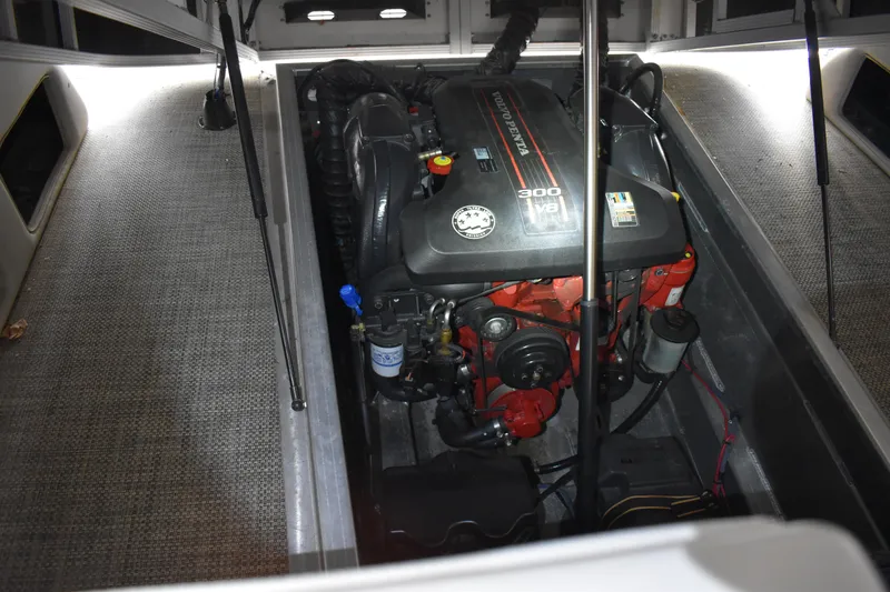 Slide: The Image of Engine compartment of a 2013 Bennington 2575 QCW I/O boat, featuring a powerful motor. - 9