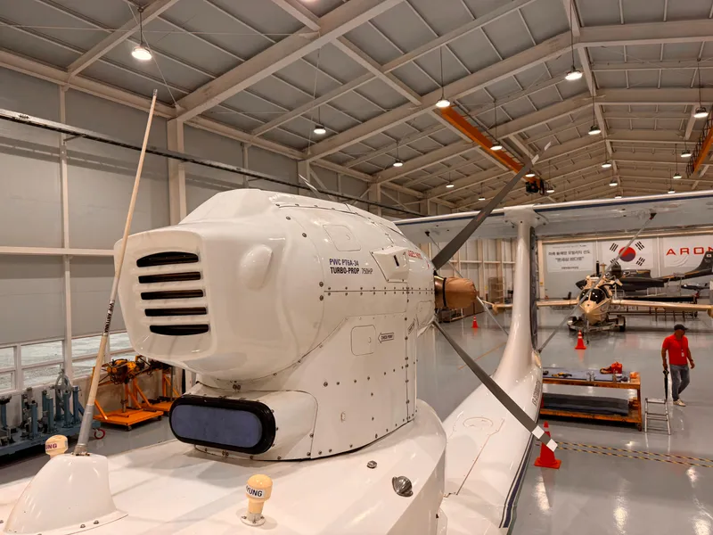 Slide: The Image of Modern Aron M 80 aircraft in a spacious hangar, showcasing advanced design and technology, 2025 model. - 12