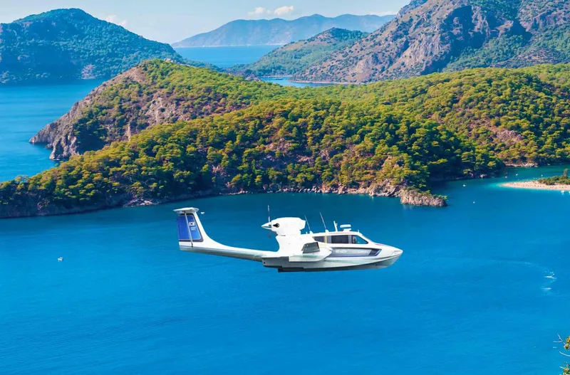 Slide: The Image of Seaplane Aron M 80 (2025) flying over scenic coastal landscape with lush green islands. - 2