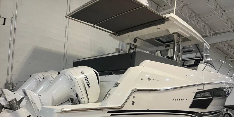 Slide: The Image of 2021 Jeanneau Leader 12.5 WA boat with Yamaha engines in a showroom. - 20