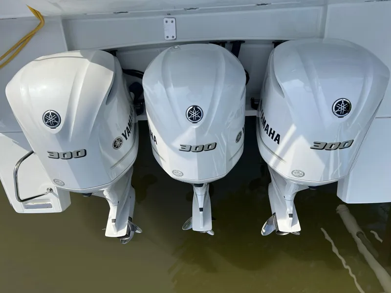 Slide: The Image of Triple Yamaha 300 outboard engines on a 2021 Jeanneau Leader 12.5 WA boat. - 23