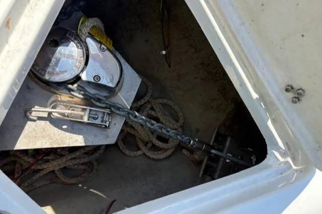 Slide: The Image of Anchor compartment of 2017 Crownline 285 SS boat with chain and ropes. - 31
