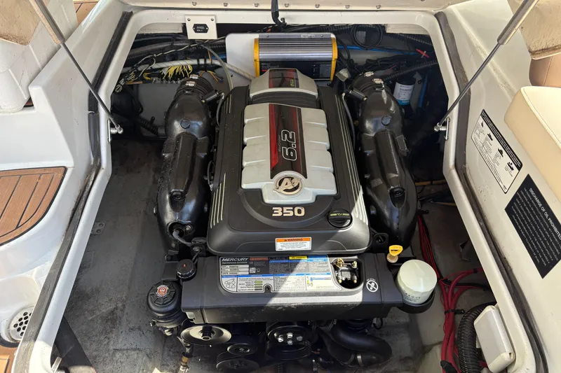 Slide: The Image of Engine compartment of a 2017 Crownline 285 SS boat, featuring a 350 horsepower engine. - 32