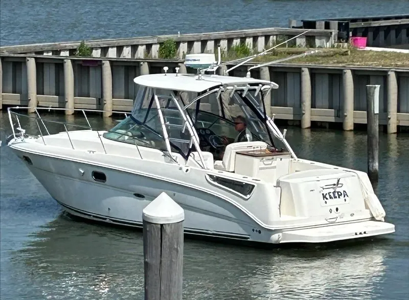 Slide: The Image of 2008 Sea Ray 290 Amberjack boat docked in a marina. - 3