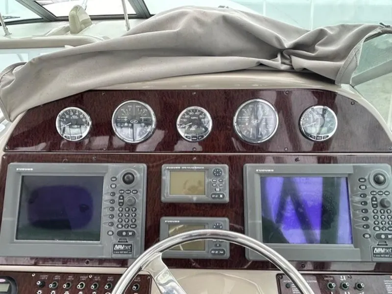 Slide: The Image of Dashboard of a 2008 Sea Ray 290 Amberjack with navigation instruments and gauges. - 4