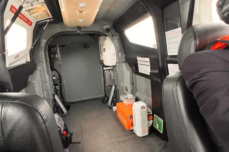 Slide: The Image of Interior of Aron M 80 aircraft, 2025 model, featuring seating and safety equipment. - 23