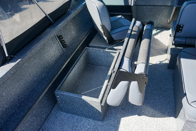 Slide: The Image of 2024 Alumaweld Talon 18 interior with foldable seating and storage compartment. - 10