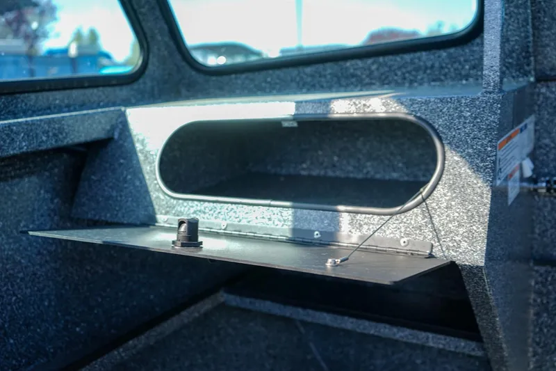Slide: The Image of 2024 Alumaweld Talon 18 boat interior storage compartment with open hatch. - 15