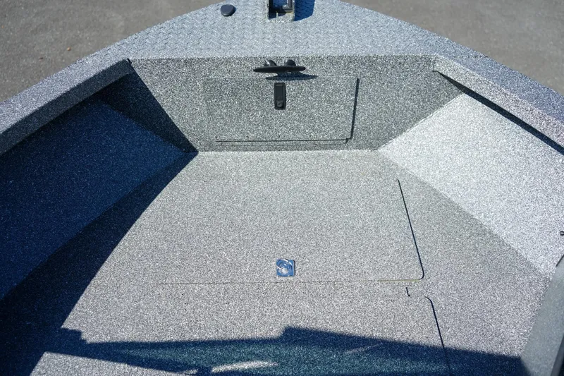 Slide: The Image of 2024 Alumaweld Talon 18 boat interior with textured flooring and storage compartment. - 18