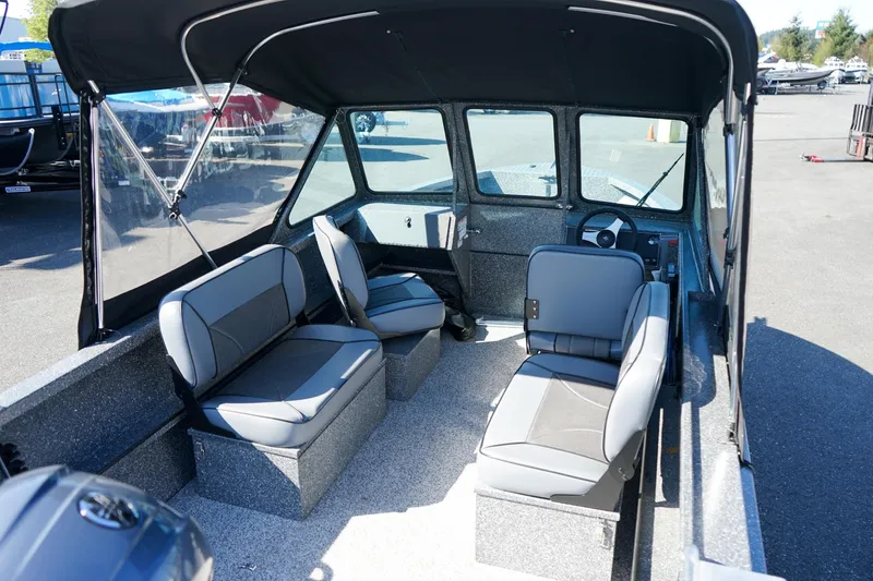 Slide: The Image of 2024 Alumaweld Talon 18 boat interior with seating and steering wheel. - 6