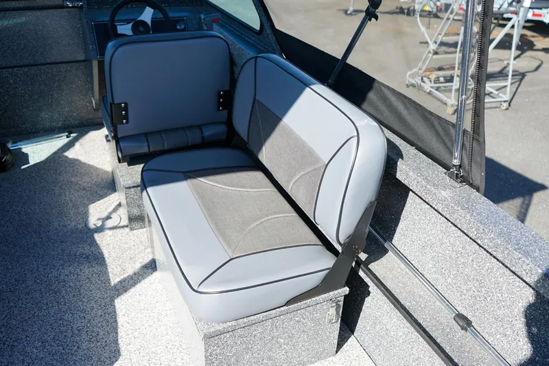 Slide: The Image of 2024 Alumaweld Talon 18 interior with gray seating and steering wheel. - 7