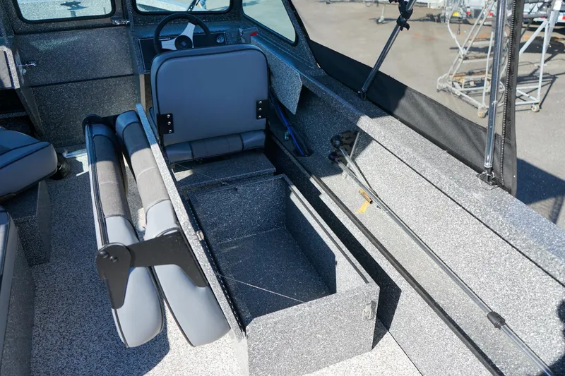 Slide: The Image of 2024 Alumaweld Talon 18 interior with seating and storage compartments. - 8