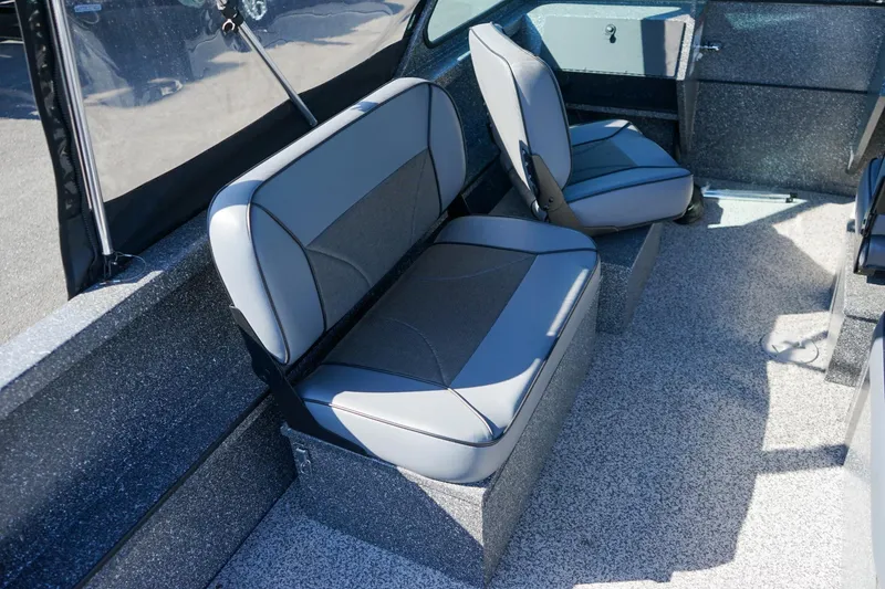 Slide: The Image of 2024 Alumaweld Talon 18 interior with gray seating and textured flooring. - 9