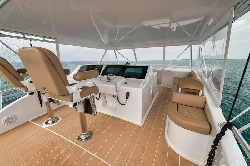 Slide: The Image of Luxurious helm of a 2001 Viking 65 yacht with modern controls and seating. - 20